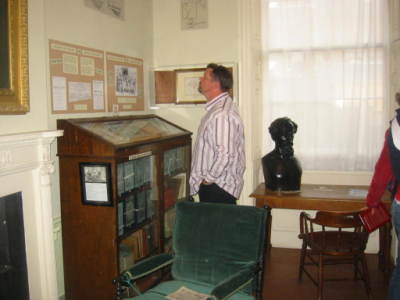 My husband exploring the Dickens' artifacts